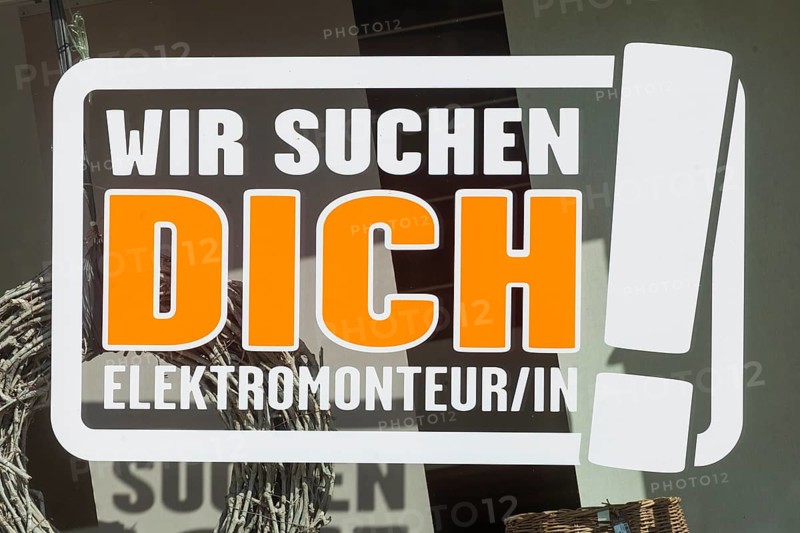 Sign we are looking for you, electrician on a shop window of an electrical shop, shortage of skilled labour, Germany, Europe