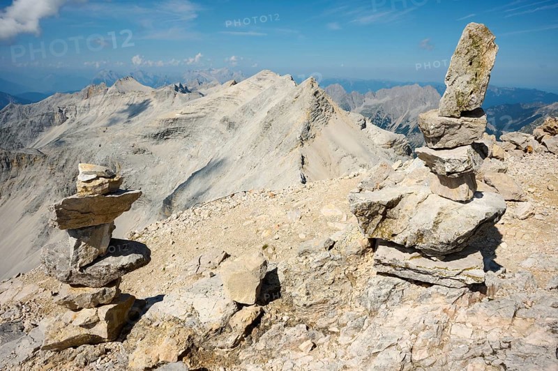 Stone men, Steinmandl at the summit of the Birkkarspitze, behind Ödkarspitzen, Alpenpark Karwendel, Tyrol, Austria, Europe