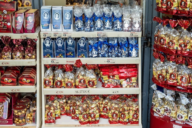 Shelves full of packaged chocolates and sweets in a shop with price labels, Mozartkugeln, Salzburg, Austria, Europe