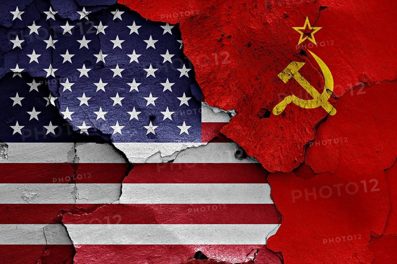 Flags of USA and Soviet Union painted on cracked wall