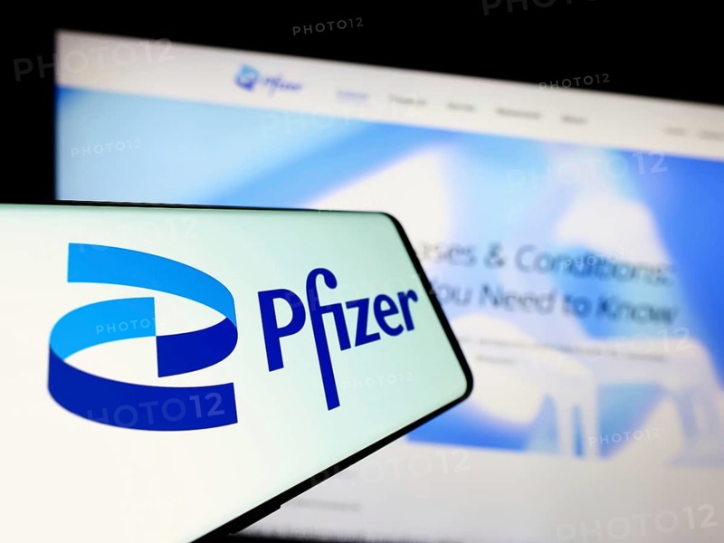 Stuttgart, Germany, 08-06-2023: Cellphone with logo of American pharmaceutical company Pfizer Inc. on screen in front of business website. Focus on center-left of phone display, Europe