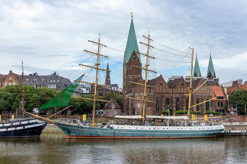 Panoramic photo of the promenade on the Weser with the sailing ship restaurant Dreimaster Alexander von Humboldt and St. Martin's Church in the background, Old Town Bremen, Hanseatic City of Bremen, Germany, Europe