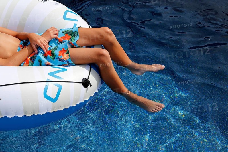 Summer, boy relaxing in swimming pool, Province of Quebec, Canada, North America