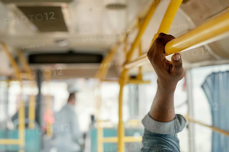 Close up hand holding bus bar