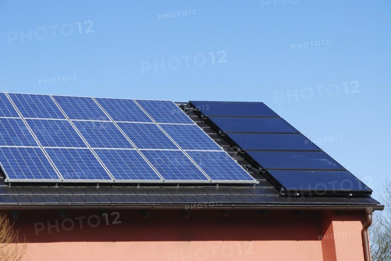 House roof with photovoltaics installation and solar heating system