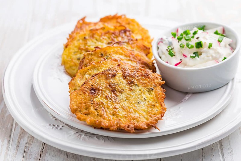 Fried potato pancake with radishes cream cheese and chives. Vegetarian food concept