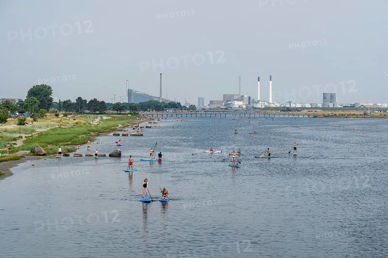 Copenhagen, Denmark, June 21, 2021: People doing SUP, stand up paddle at Amager Beach Park, Europe