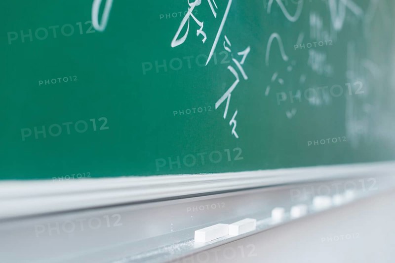 Chalkboard with written mathematical formulas