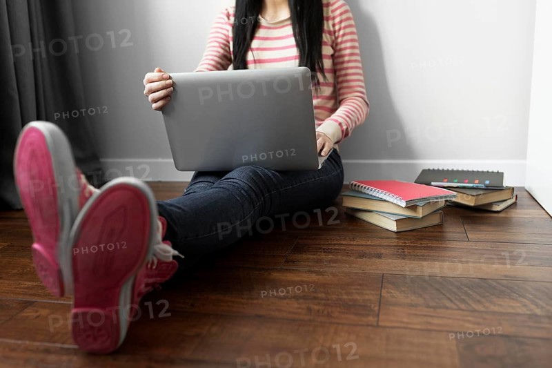 Close up student holding laptop