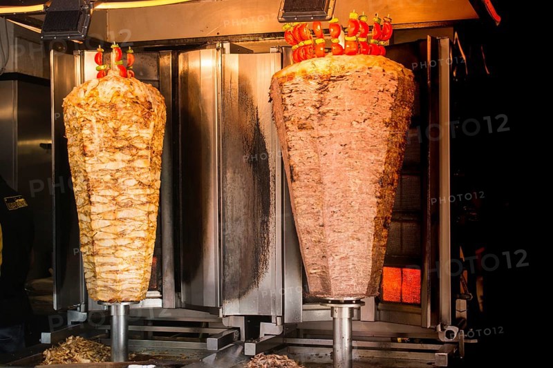 Traditional Turkish food Doner Kebab. Turnspit skewing kebap kebab shawarma