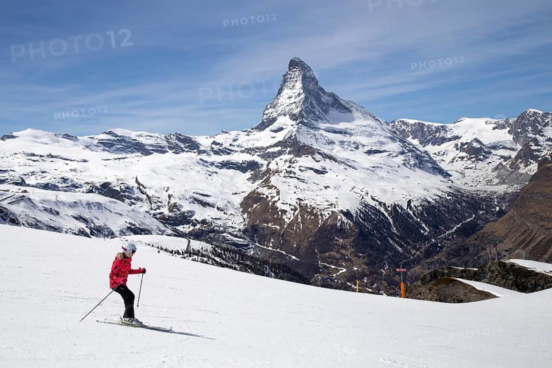 Zermatt, Switzerland, April 12, 2017: A woman skiing in front of the famous Matterhorn, Europe