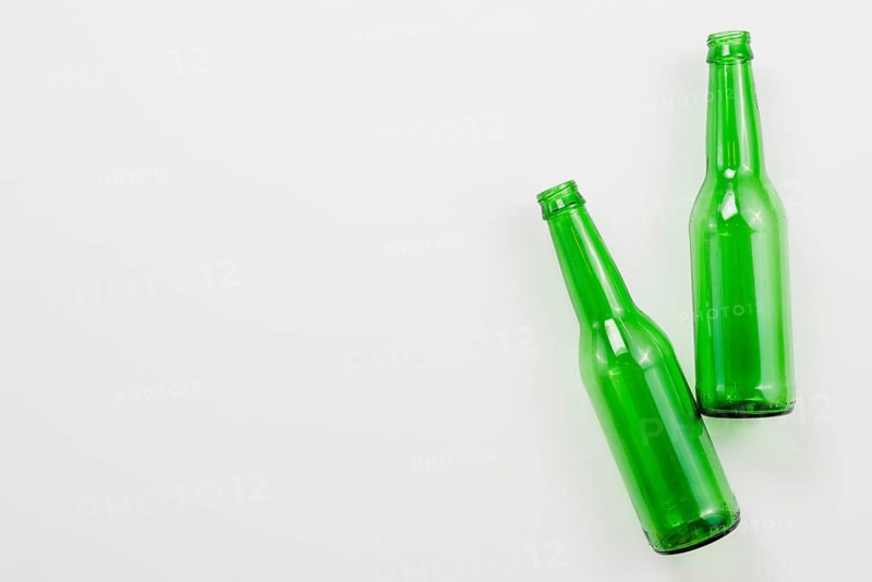 Green empty bottles white background