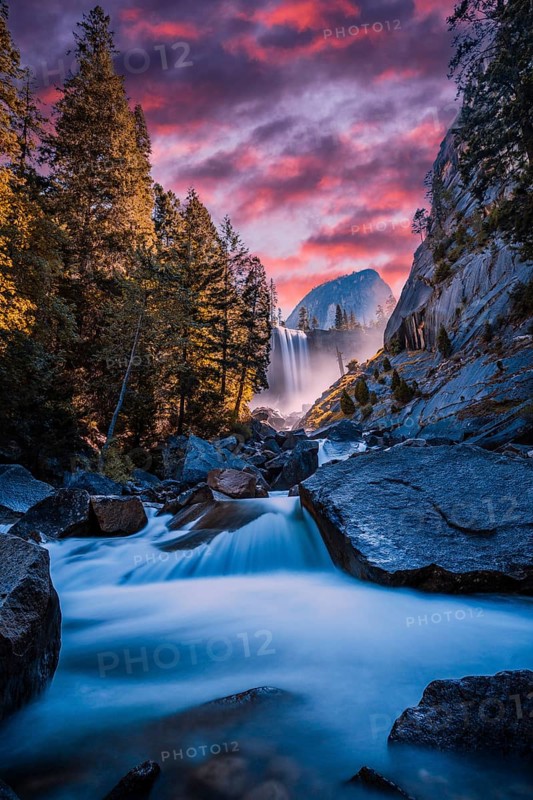 Vernal Falls waterfall of Yosemite National Park from the water that falls into the stones in sunset, long exposure photo. California, United States, North America