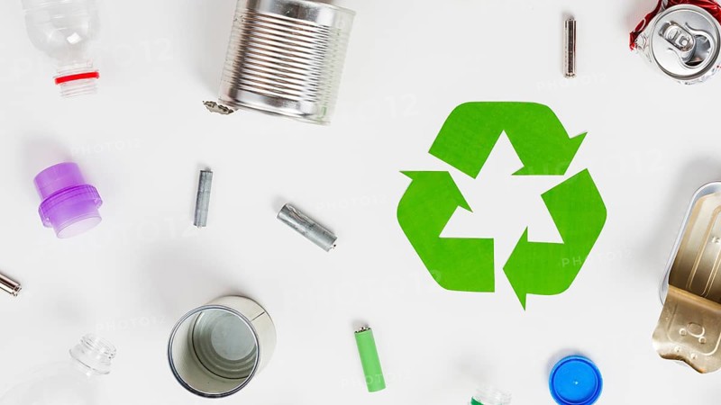 Recycling icon around different litter