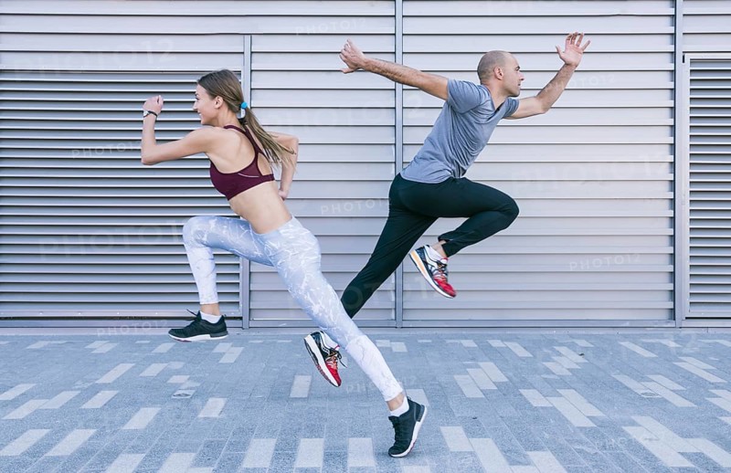 Active sportive young male female athlete running jumping air. Resolution and high quality beautiful photo