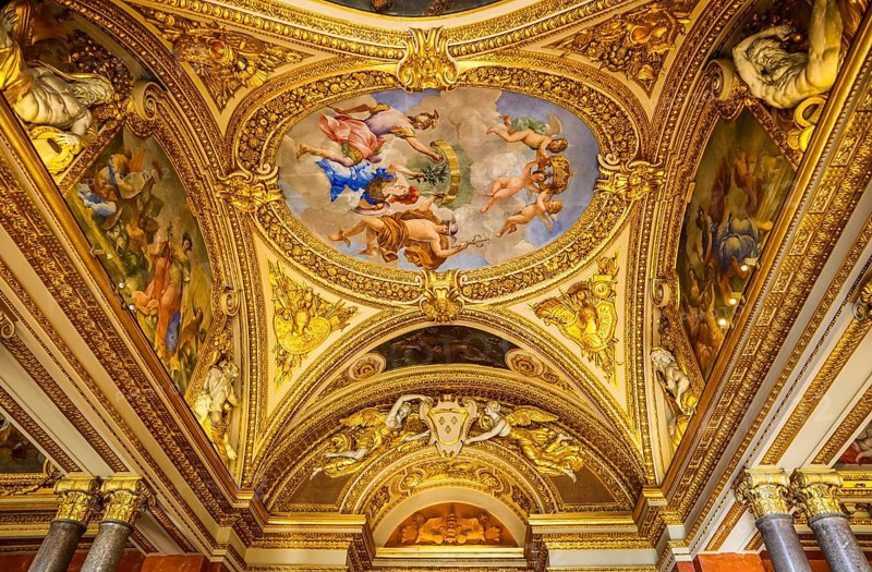 France, April 05 2019. Inside of richly decorated louvre museum. Beautiful ceiling, Europe