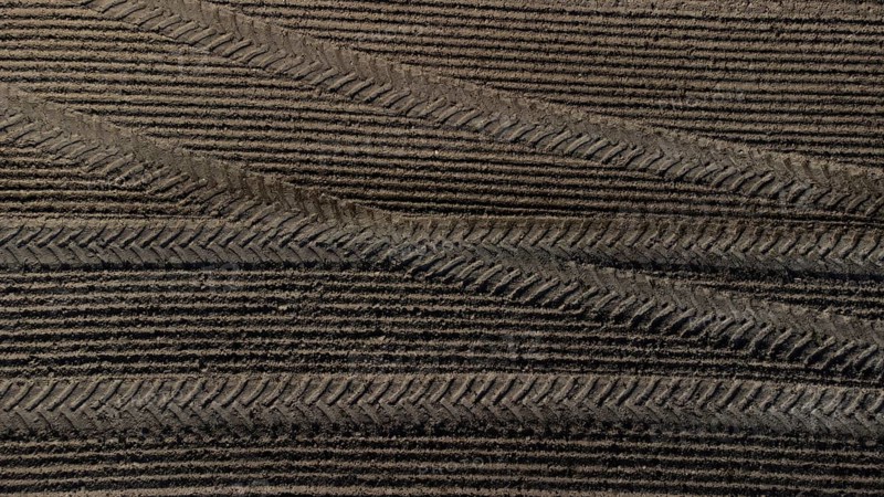 Tractor tyre tracks form an interesting pattern on a freshly cultivated field without vegetation, drone image, Upper Bavaria, Bavaria, Germany, Europe