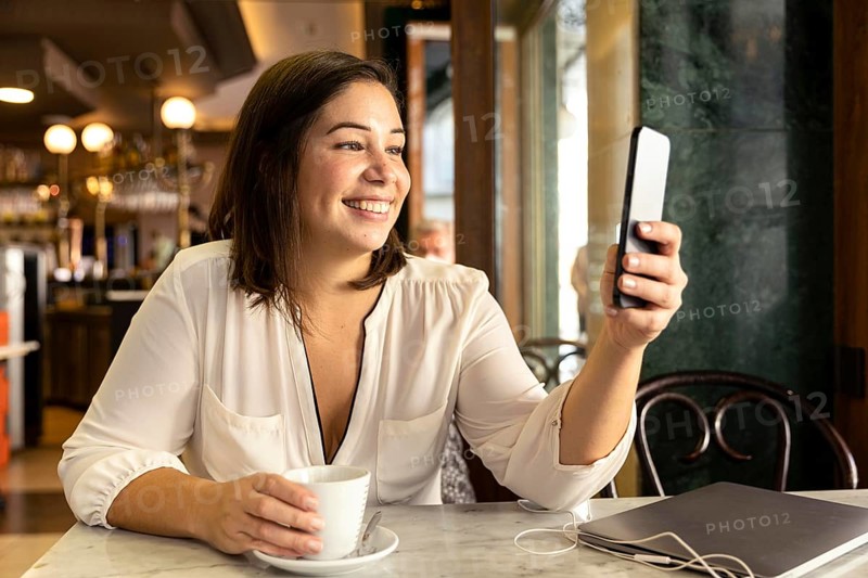Pretty teenager browsing her mobile phone