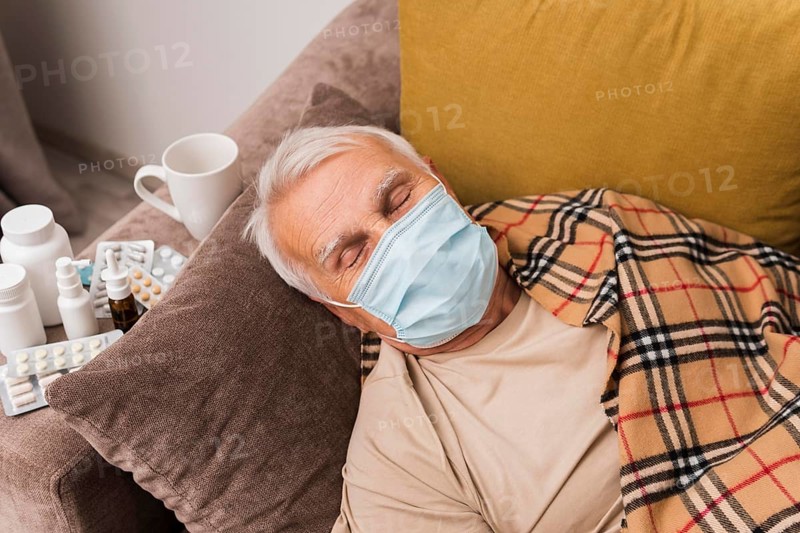 High angle man sleeping with mask
