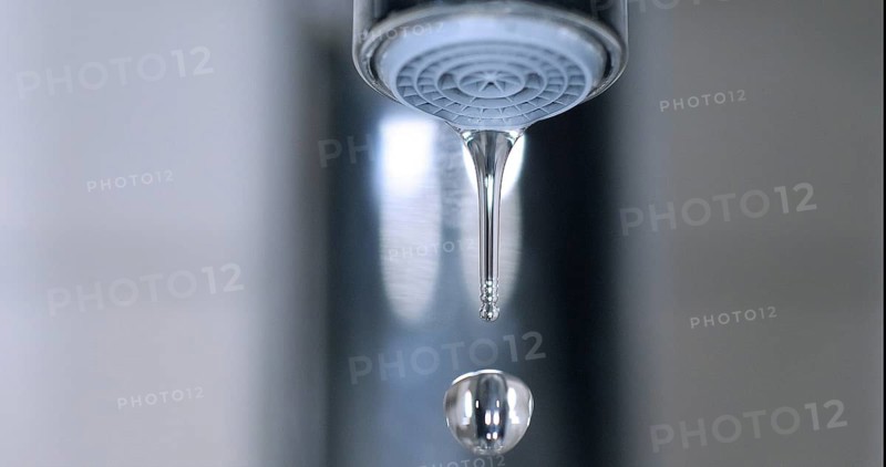 Water Flowing from the Tap, making a drop of water