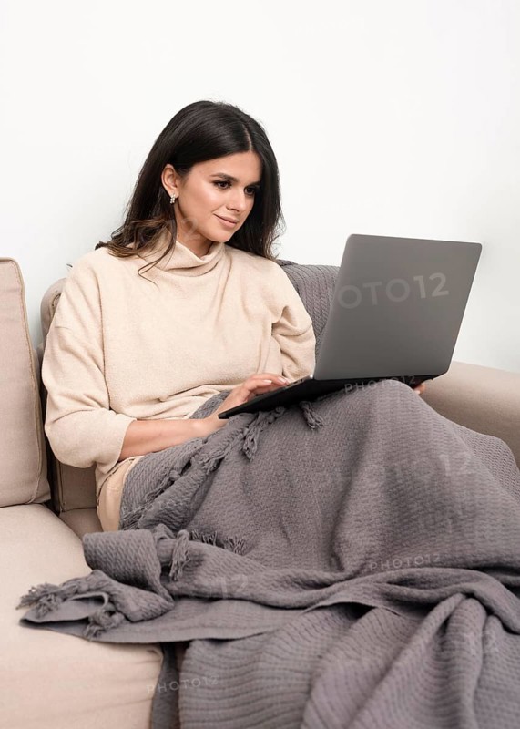 Woman couch working from home