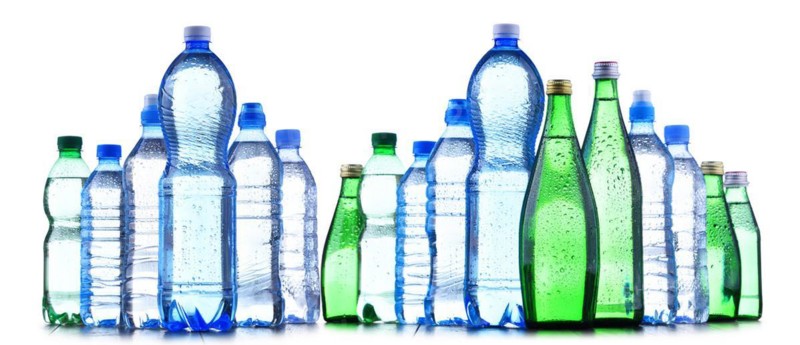 Composition with different sorts of bottles containing mineral water isolated on white