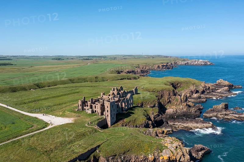 Cruden Bay, United Kingdom - 23 June, 2022: drone view of Slains Castle and the wild coast of Aberdeenshire