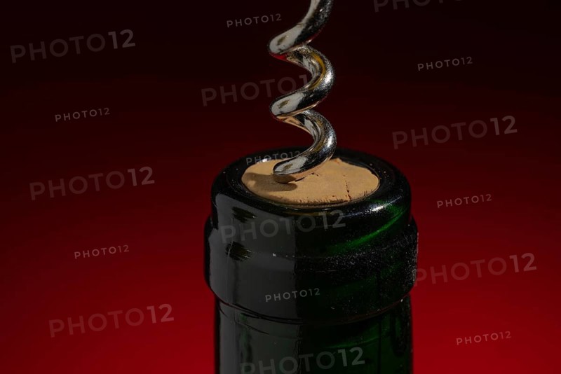 Green wine bottle with cork and corkscrew, bottle opener, decoration, open