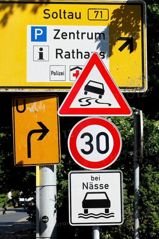 Traffic sign Maximum permitted speed 30 kilometres per hour in wet conditions, risk of skidding, Germany, Europe