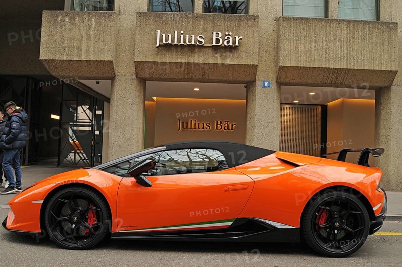 Switzerland: A orange Lamborghini in front of Julius Bär bank at Bahnhofsstrasse in Zurich city