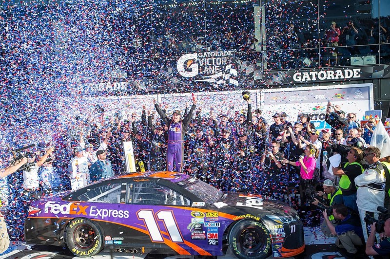 Daytona Beach, FL, Feb 21, 2016: Denny Hamlin celebrates his win in Victory Lane during the Daytona 500 weekend at the Daytona International Speedway in Daytona Beach, FL
