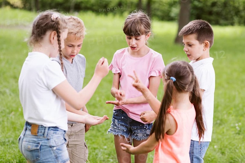 Children playing rock scissors paper