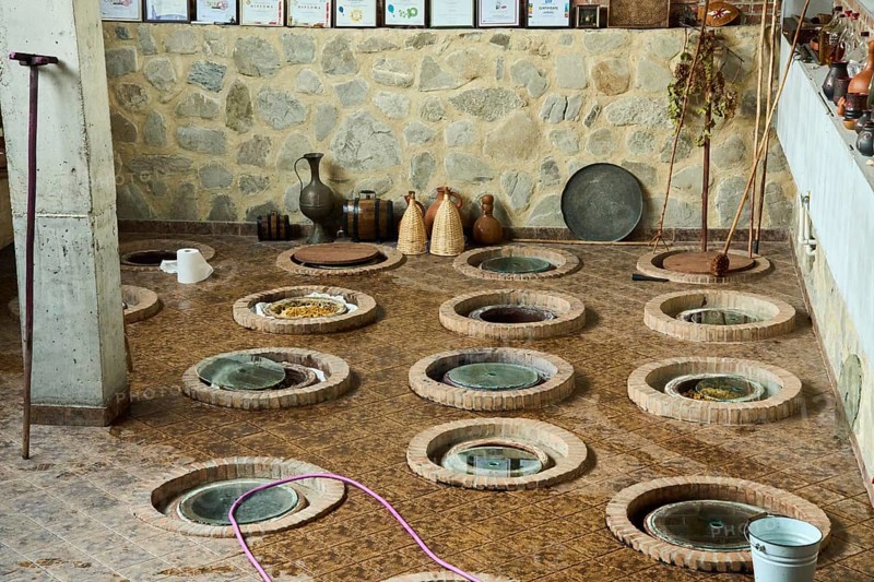 Wine cellar with traditional large earthenware vessels buried in the ground, Qvevri, Kvevri, in which the wine ferments, stores and matures, this method originated 8000 years in front of Christ in Georgia, Babaneuris Marani Winery and Hotel, Kakheti, Georgia, Asia
