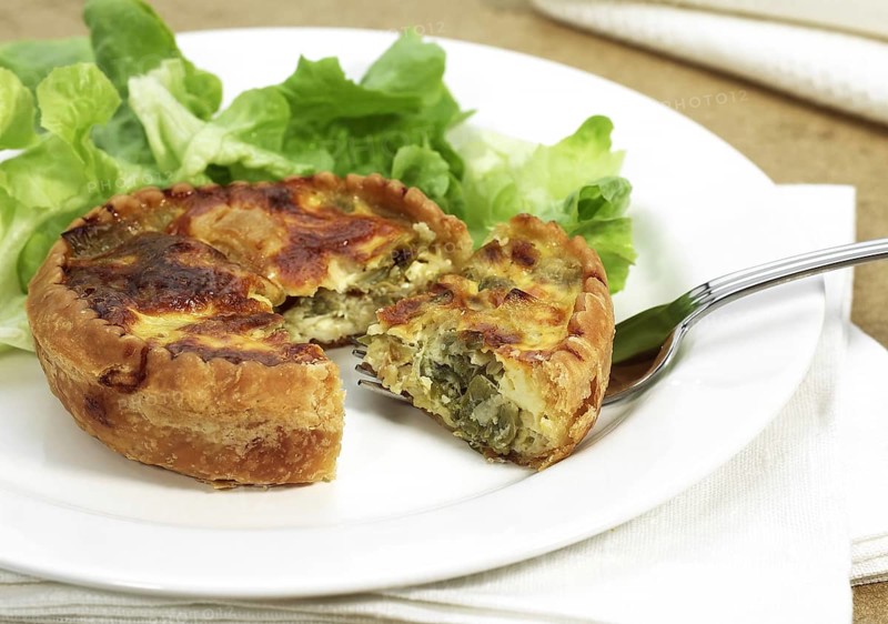 Leek quiche and salad on a plate