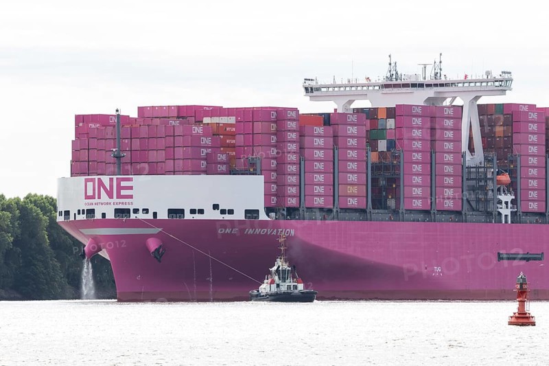 Pink container freighter One Innovation of the shipping company Ocean Network Express (Europe) Ltd. on the Elbe River entering the Port of Hamburg, Hamburg, Germany, Europe
