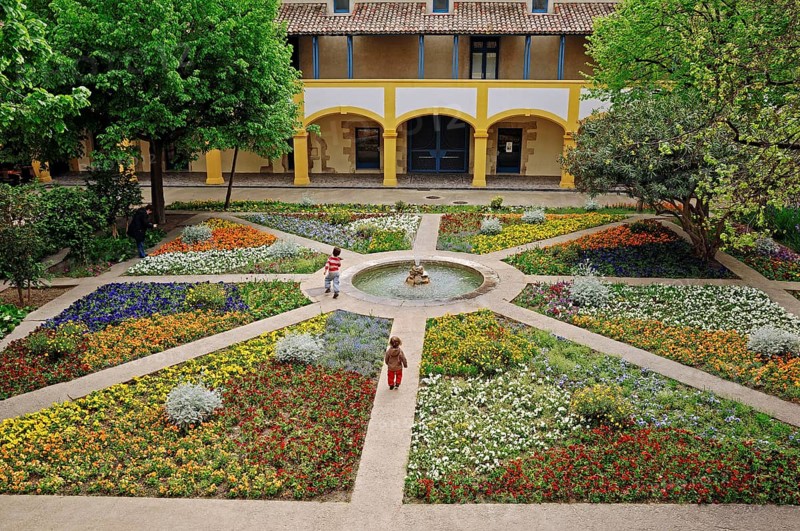 Garden with fountain, Espace Van Gogh cultural centre, former hospital, Arles, Bouches-du-Rhone, Provence-Alpes-Cote d'Azur, Southern France