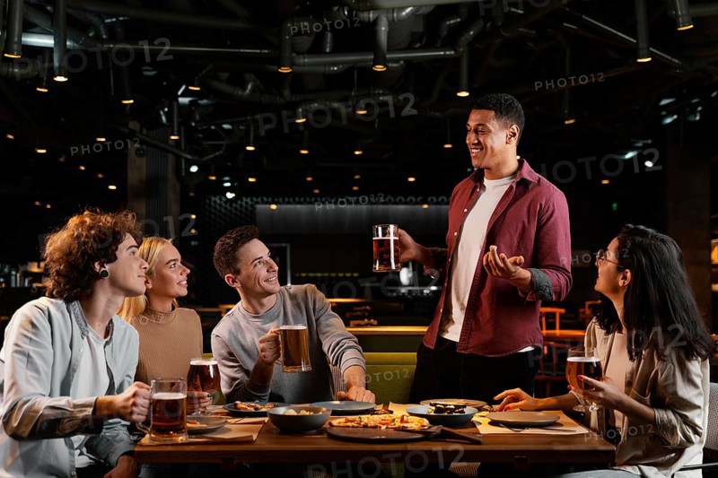 Medium shot friends with beer pub