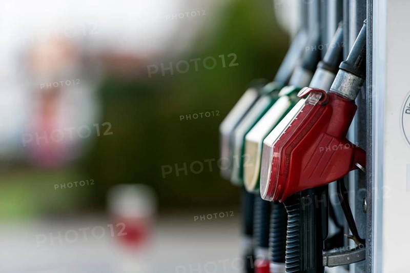 Petrol pump with nozzles at a petrol station