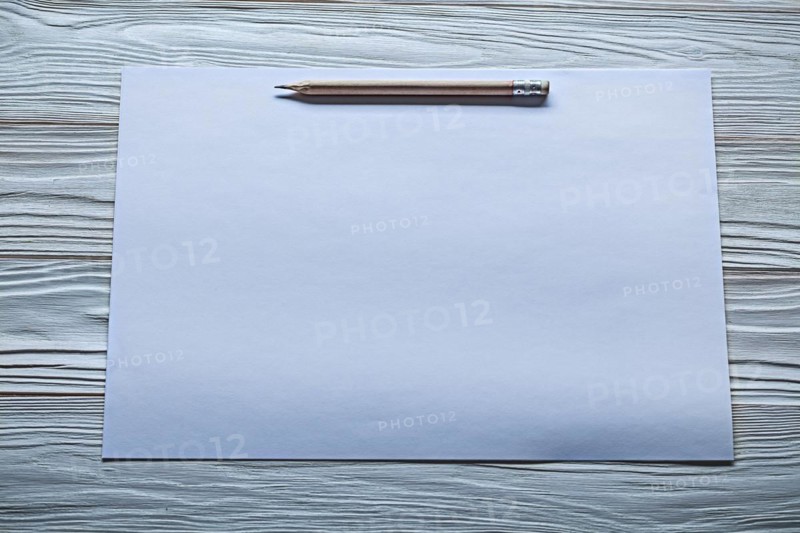 White paper with pencil marks on old wooden panels