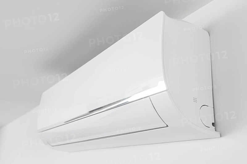 Indoor Air conditioner unit mounted on wall used for heating or cooling a space. Domestic system