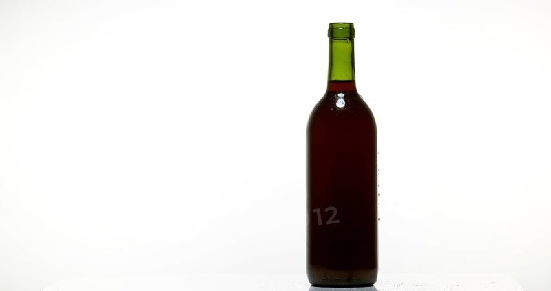 Bottle of Red Wine against White Background