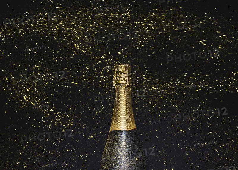Bottle champagne flying golden glitters