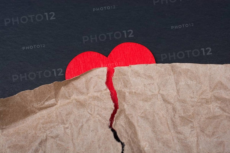 Heart with torn paper for love care concept symbol