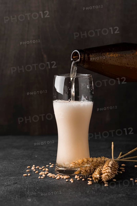 Beer bottle pouring beer glass
