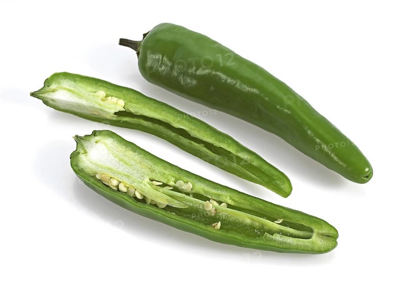 Green chili pepper (capsicum), against white background
