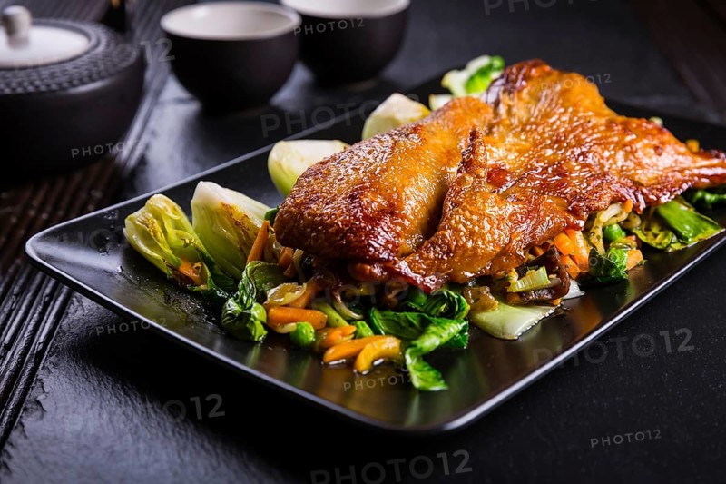 Delicious Peking duck breast with pak choi and vegetables