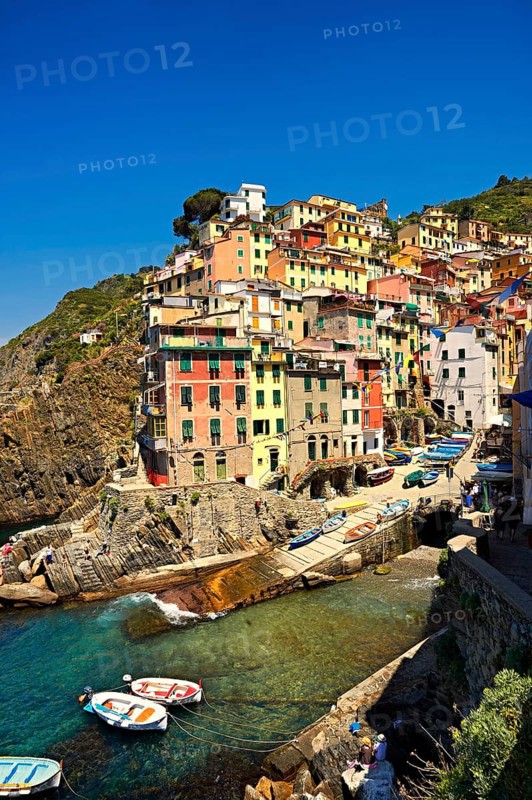 Photo of the colorful houses of the fishing port of Riomaggiore, Cinque Terre National Park, Liguria, Italy, Europe