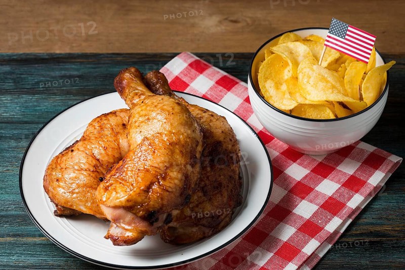 High angle chicken legs plate with chips