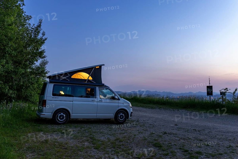 Camping with VW Bus T6.1 California, with pop-up roof and soft light, in hilly landscape, Oltingen, Basel-Landschaft, Switzerland, Europe