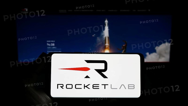 Stuttgart, Germany, 03-10-2023: Person holding smartphone with logo of aerospace company Rocket Lab USA Inc. on screen in front of website. Focus on phone display, Europe